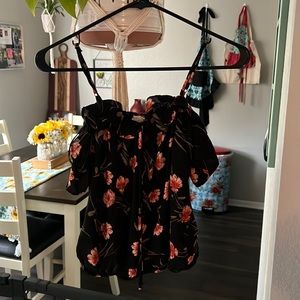 Side extra small, cute off the shoulder top with straps.